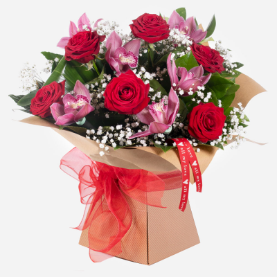 Mwah! - This gorgeous pairing of roses and orchids cannot fail to impress and give that special someone that loving feeling.